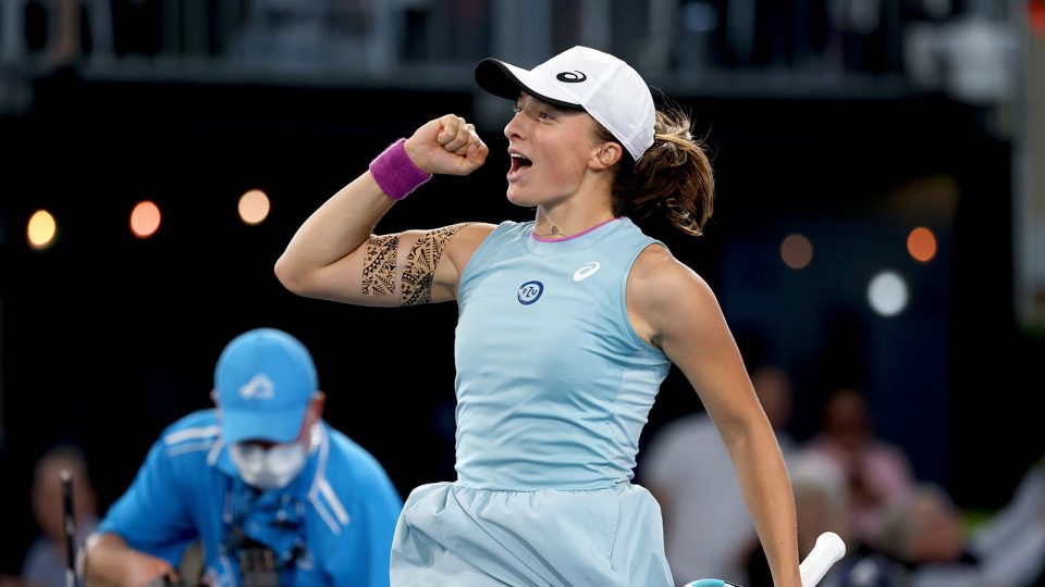 Iga Swiatek celebrates defeating Belinda Bencic in the final of the Adelaide International.