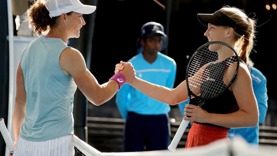 Maddison Inglis (R) shakes hands with Samantha Stosur after winning their first-round match at the 2021 Adelaide International.